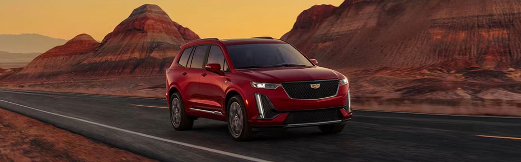 2025 Cadillac XT6 driving on a desert road